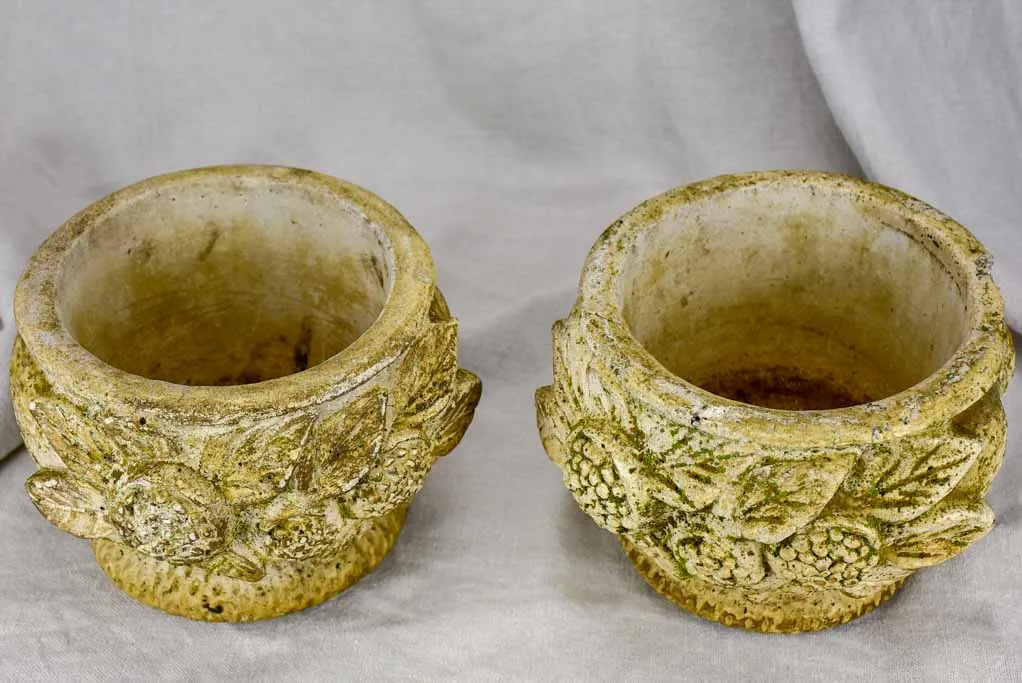 Pair of concrete flower pots decorated with pomegranates