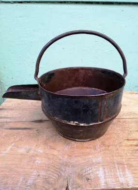 Restored antique iron curd pots.