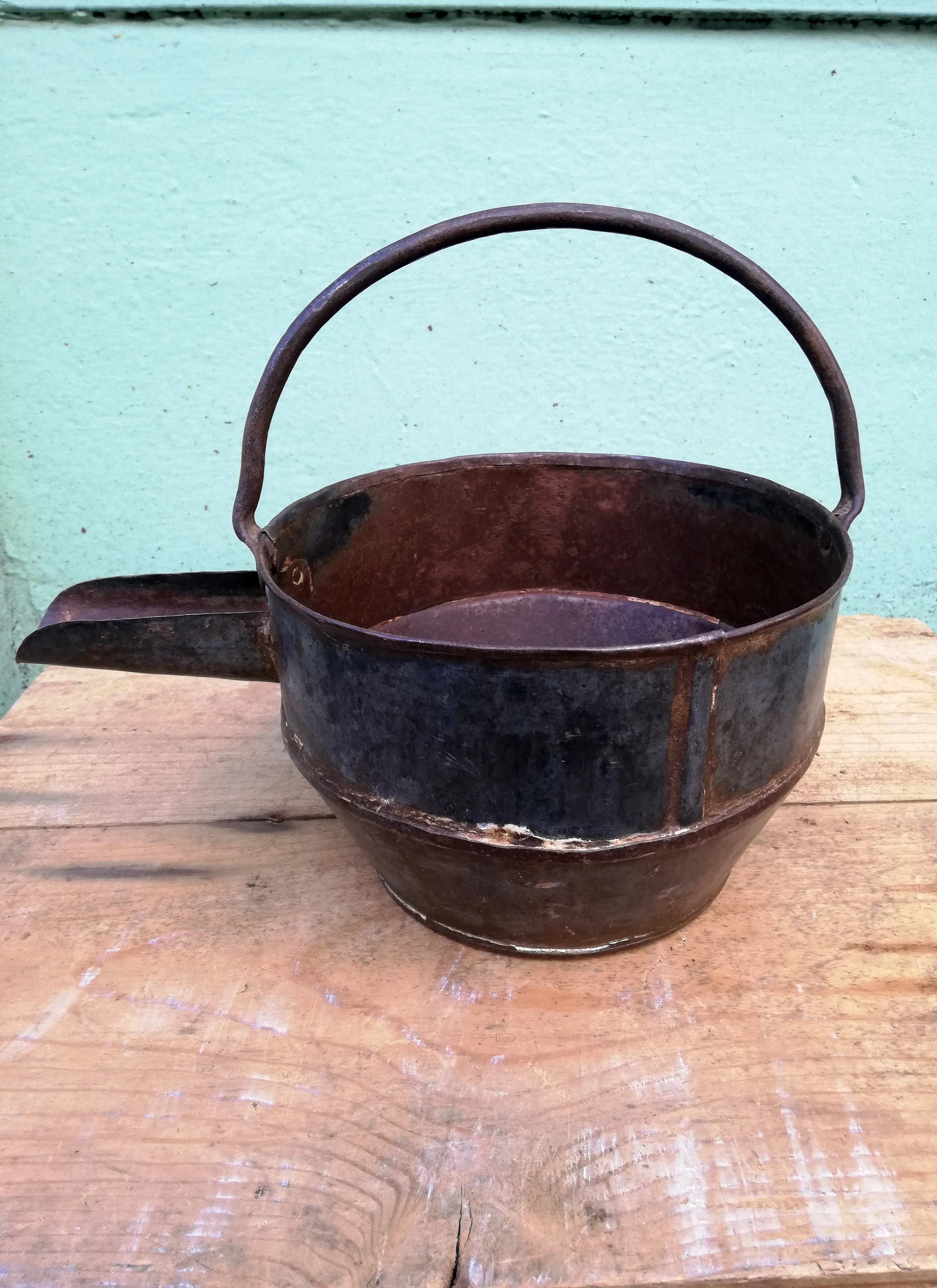 Restored antique iron curd pots.
