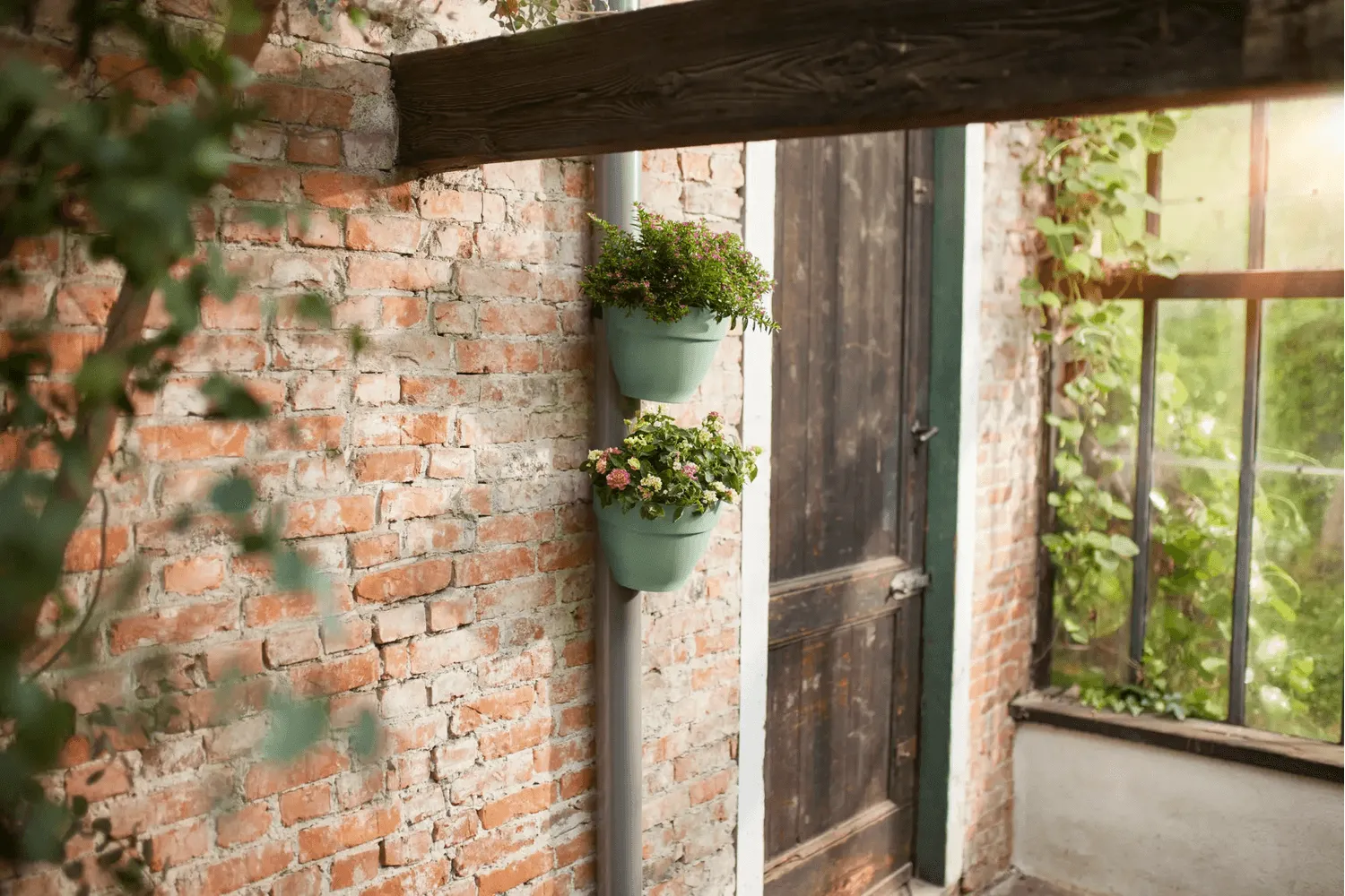 Vibia Campana flowerpot for drainpipes