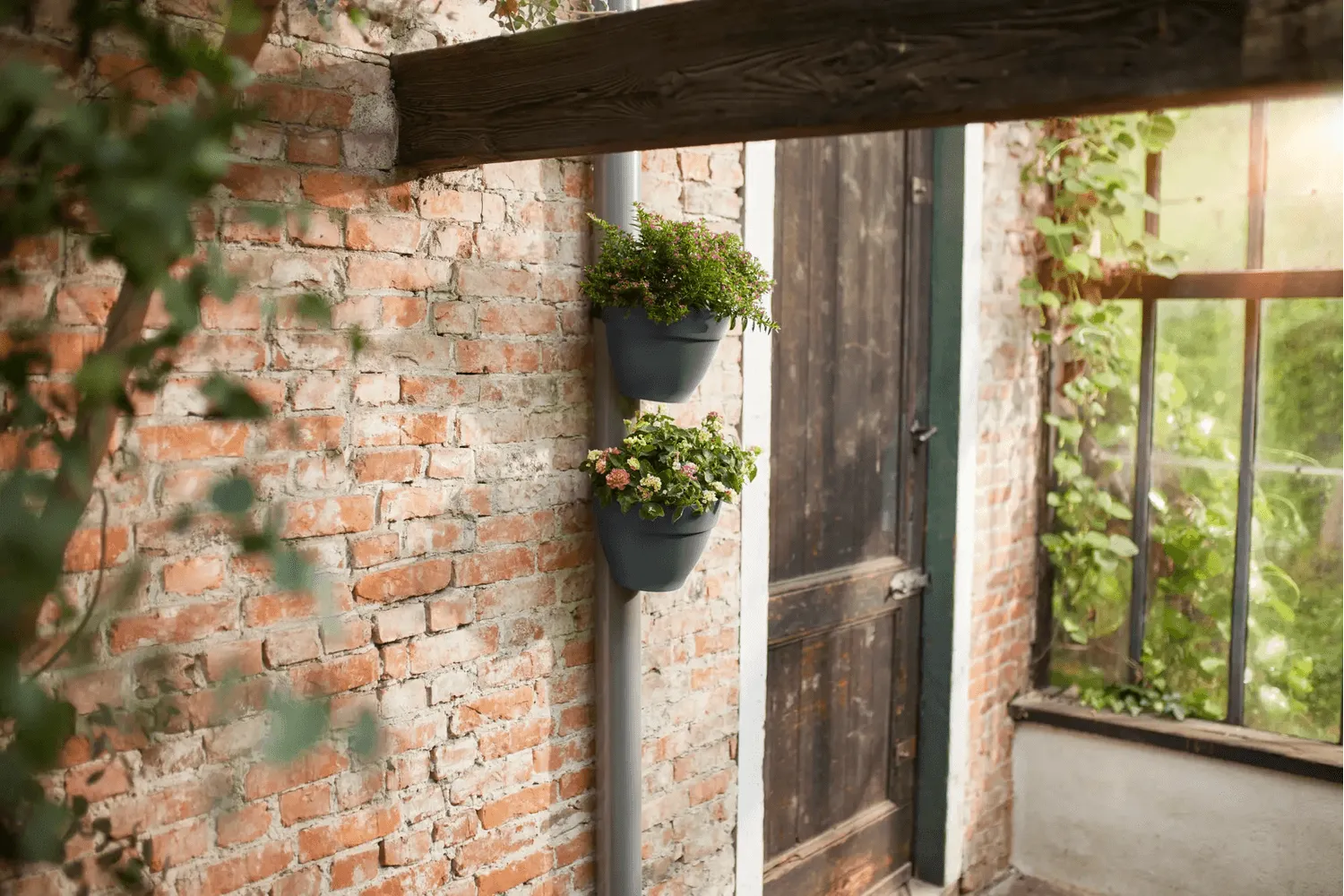 Vibia Campana flowerpot for drainpipes