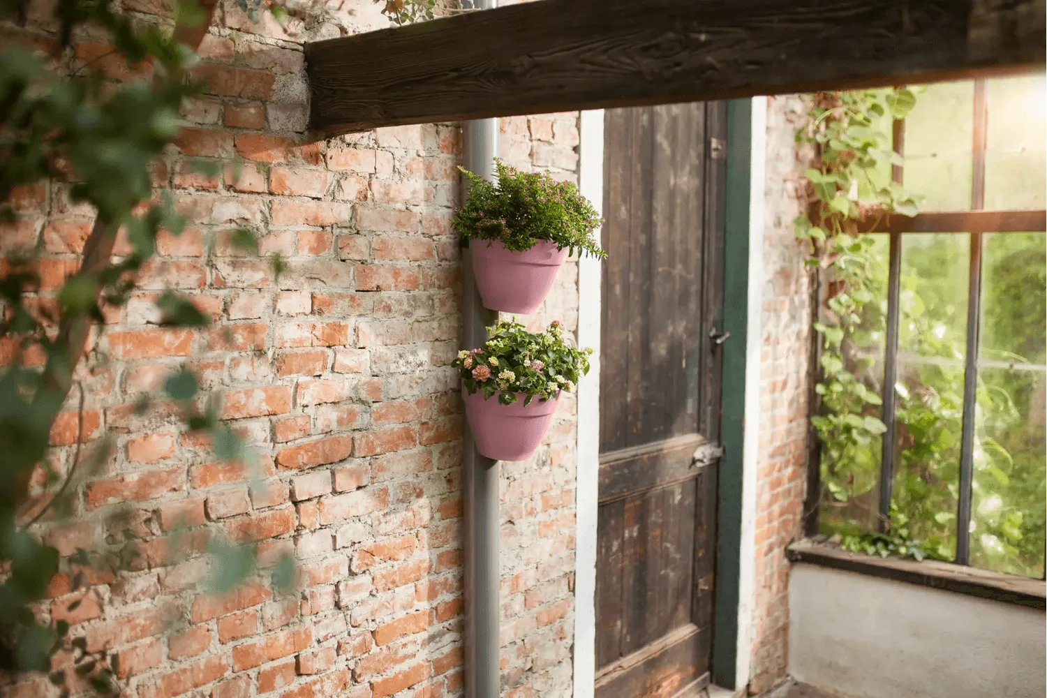 Vibia Campana flowerpot for drainpipes